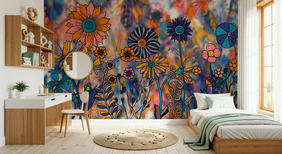 Vibrant Wildflower Wonderland wallpaper mural of bold orange and navy blooms behind a wood desk and single bed in a kids room