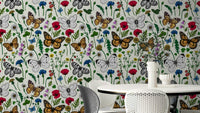 Wildflowers and butterflies wallpaper in soft pastel colors

