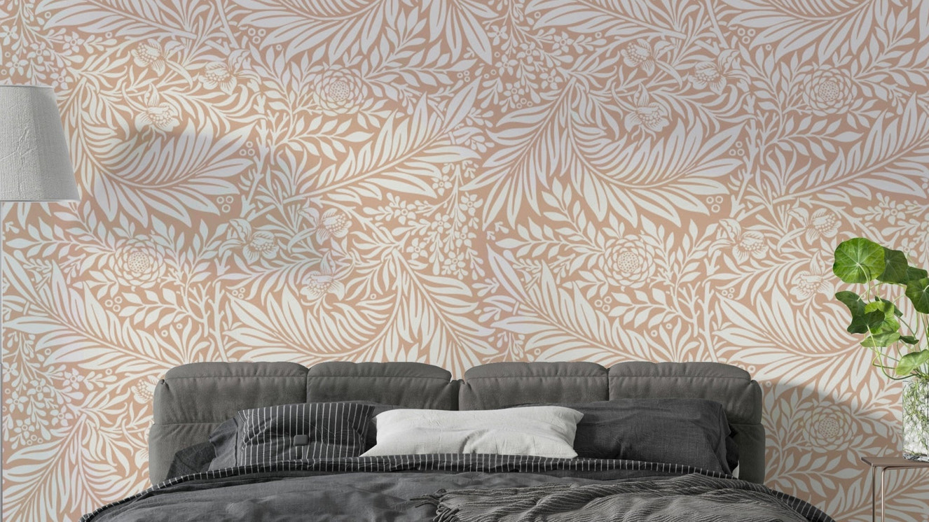 A wallpaper featuring a classic, intricate floral pattern.

