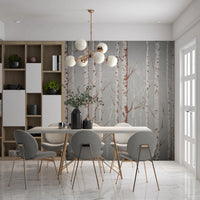 Winter Birch Beauty wallpaper mural of birch trees on grey behind a wood dining table and grey chairs in a dining room