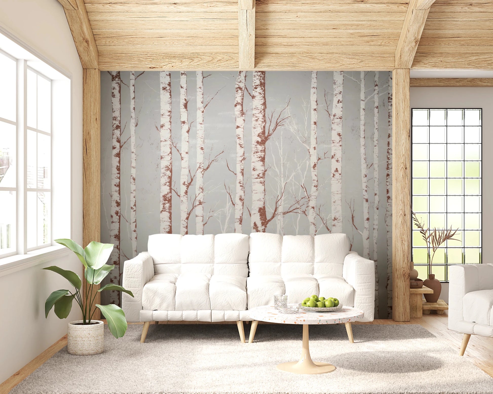 Winter Birch Beauty wallpaper mural with birch trunks on grey behind a white sofa and tulip table under wood beams in a living room
