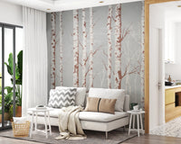 Winter Birch Beauty wallpaper mural with white birch trunks on grey behind a white daybed with grey and tan pillows in a living room