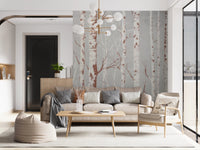 Winter Birch Beauty wallpaper mural of birch trunks on grey behind a beige sofa and wood armchair in a living room
