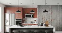 Winter Birch Beauty wallpaper mural with birch trunks on grey beside a marble island in a terracotta kitchen with stools