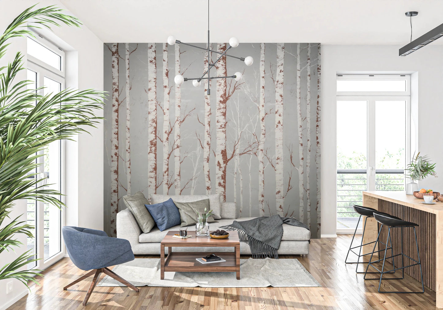 Winter Birch Beauty wallpaper mural with white birch trunks on grey behind a cream sofa and blue swivel chair in a living room