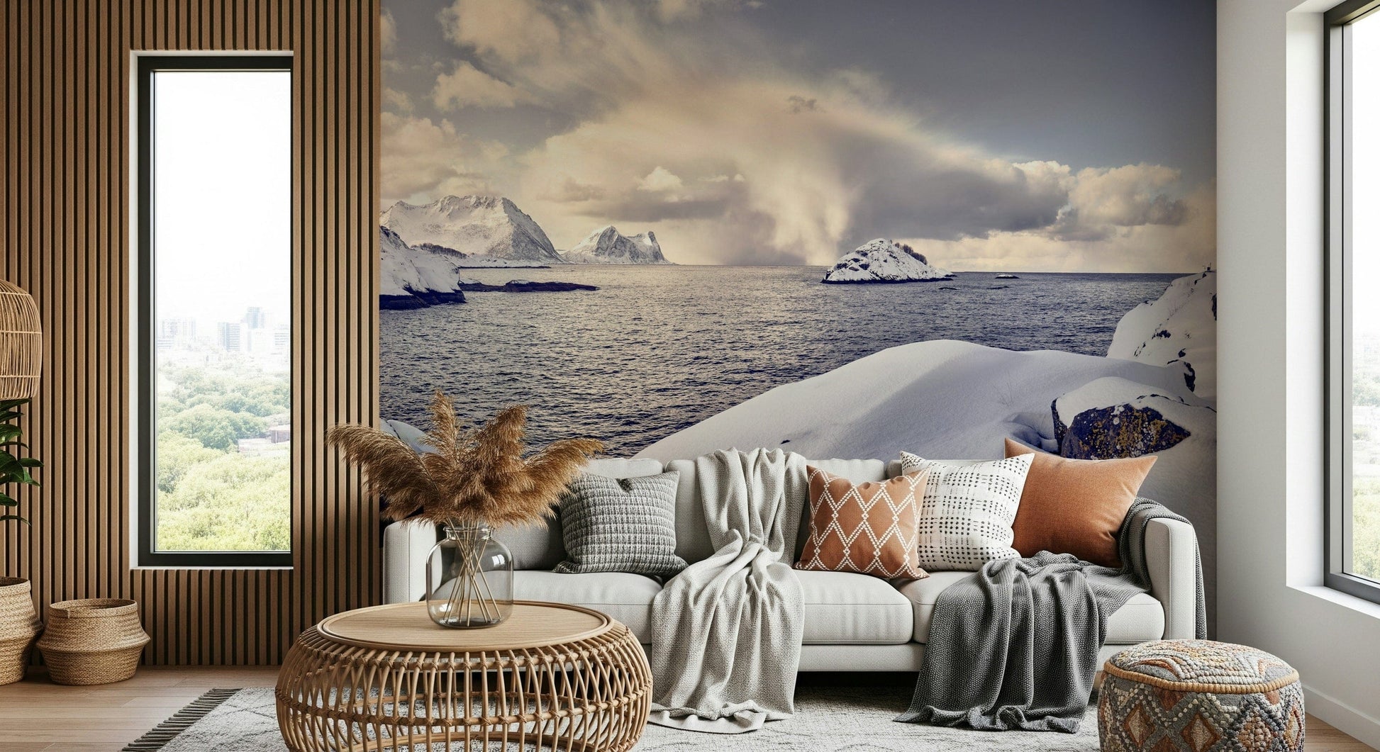 Arctic Dreamscape wallpaper mural of a snowy arctic coast behind a grey sofa with rust cushions in a living room