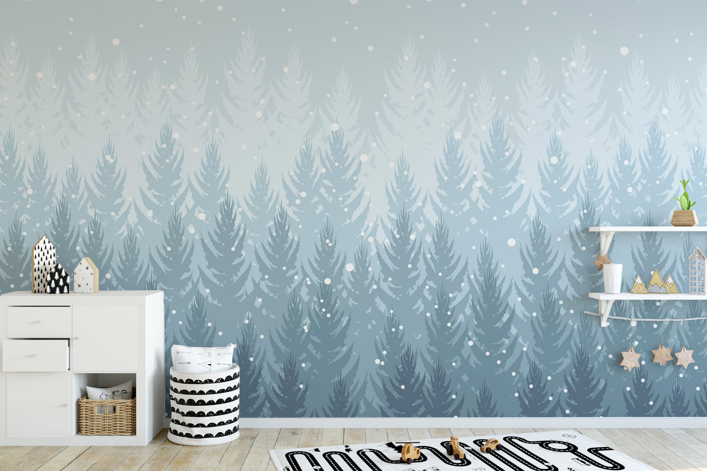 Winter Pines Forest wallpaper in pale blue behind a white dresser and star shelves in a kids room