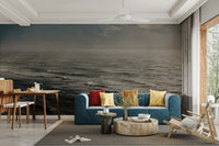 A living room with the winter surfing wall mural.

