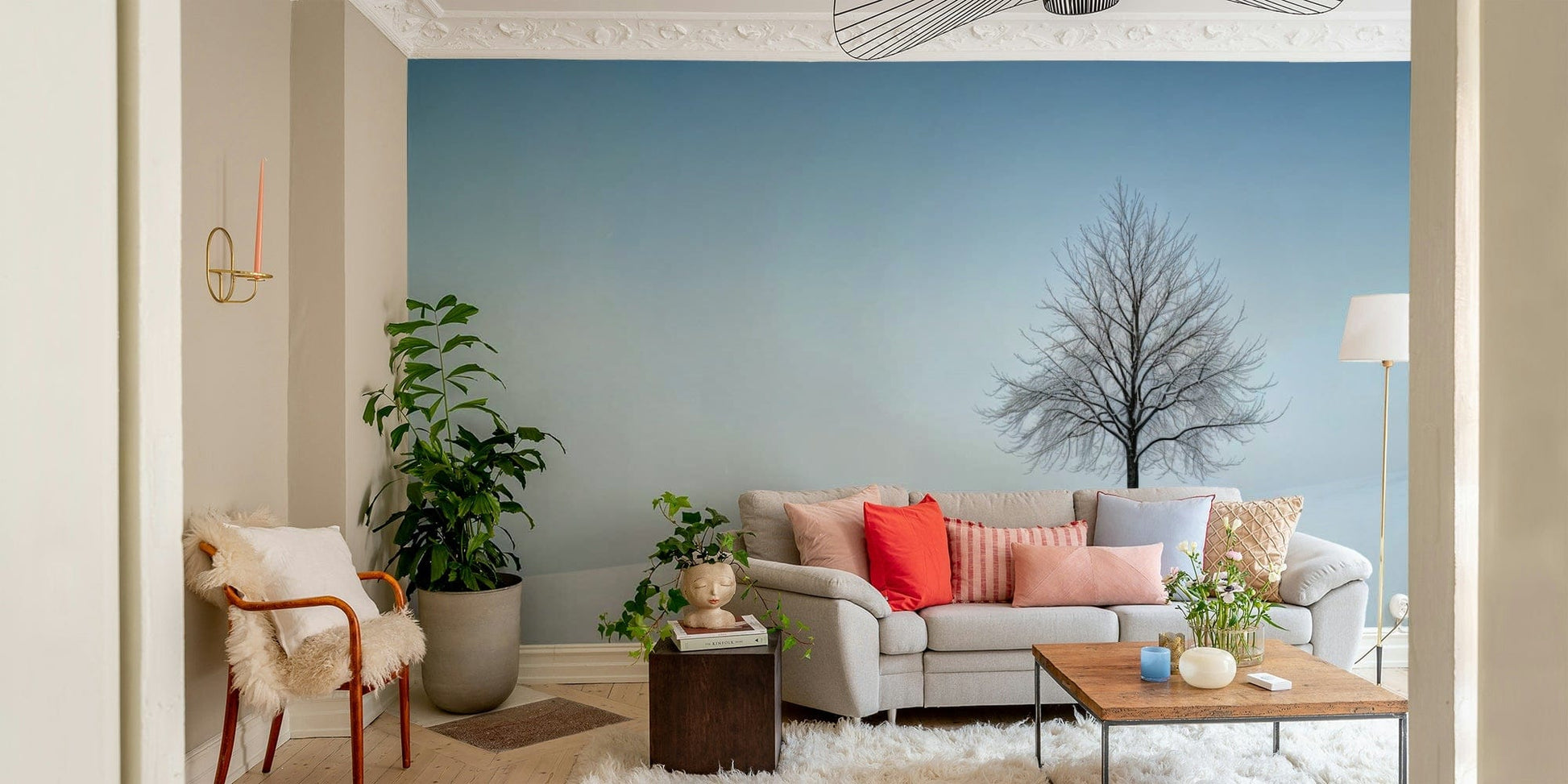 A minimalist interior with the snowy mountain wallpaper.