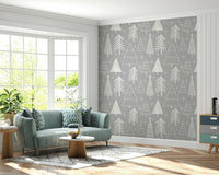 Delicate winter tree outlines in white creating a soothing festive wallpaper look.
