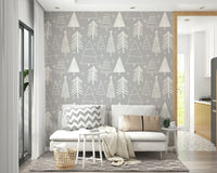 Winter forest motifs in soft white lines adding a serene touch to this gray wallpaper.