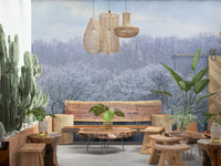 Winter's Whispers wallpaper mural of a frosted forest behind a live-edge wood bench and tall cacti on a patio
