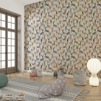 Subtle animal motif wallpaper in a light-filled morning room or conservatory.