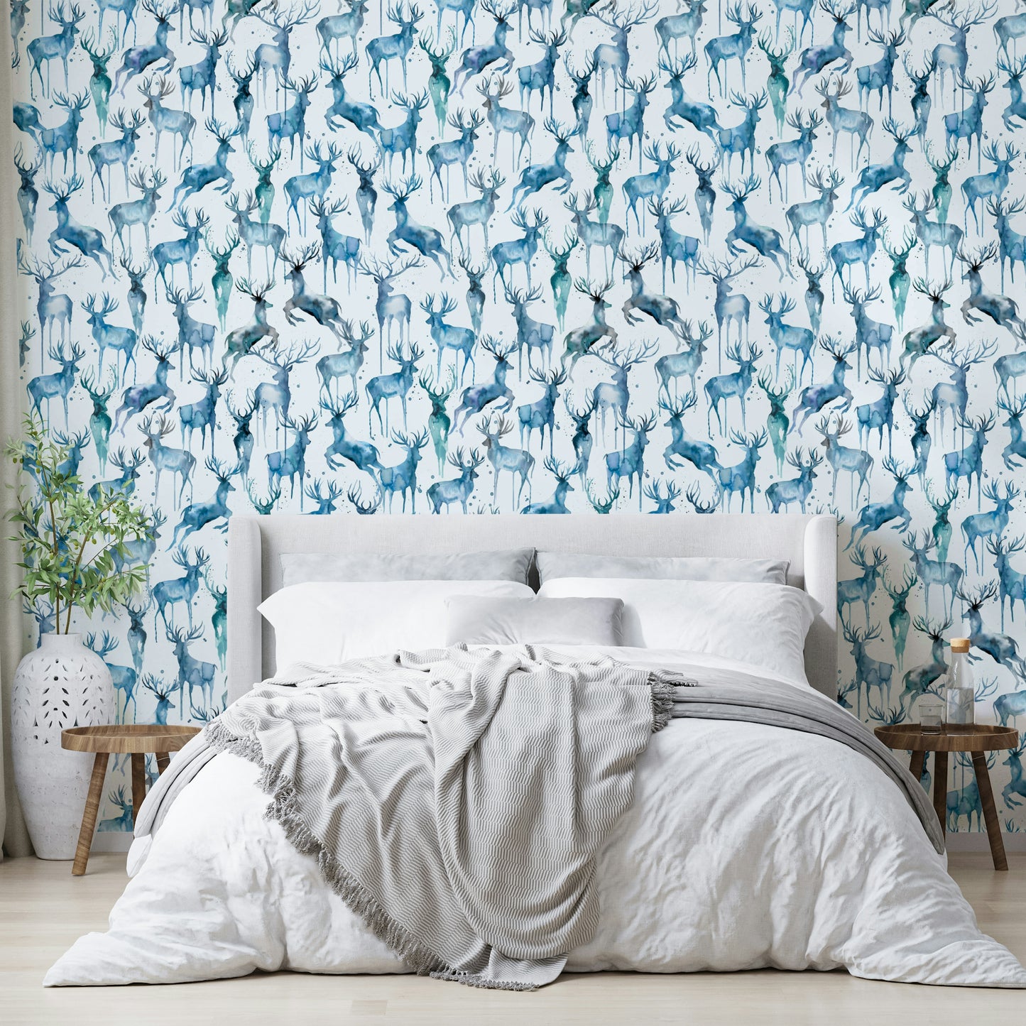Soft blue artistic trees and wildlife mural for a calm guest room.