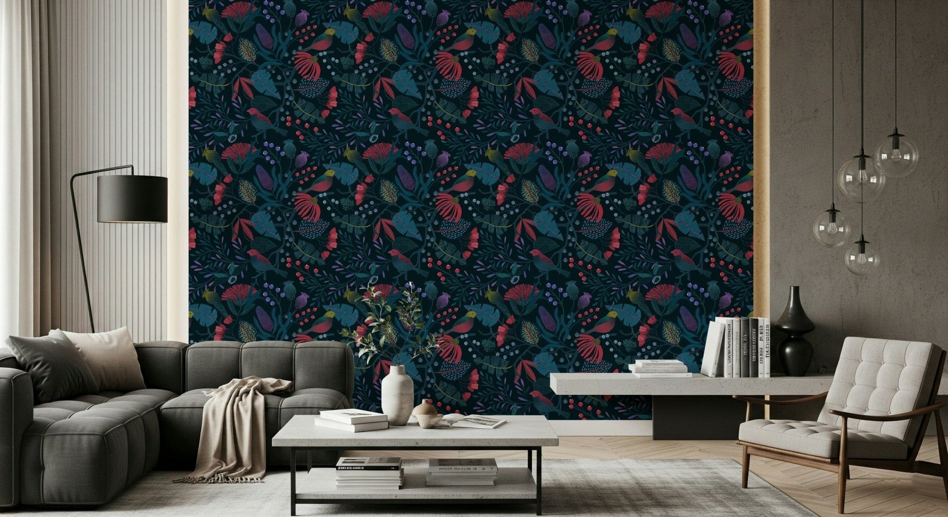 Wonderforest wallpaper in dark navy florals behind a grey sofa and tufted armchair in a sunlit living room
