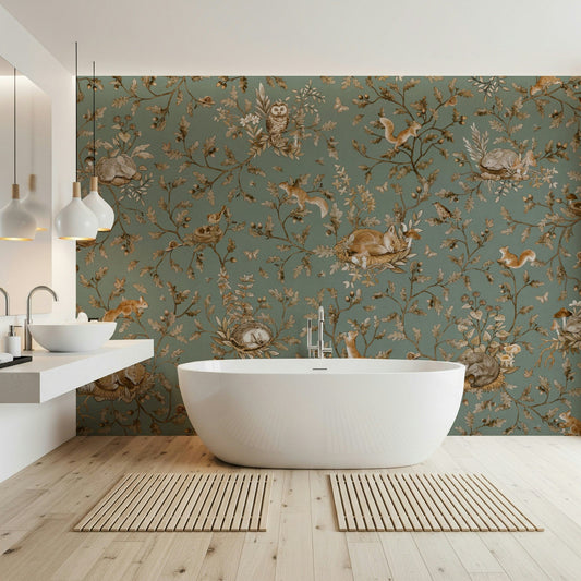 Woodland Dreams wallpaper mural in sage green in a bathroom with white oval tub and floating double vanity