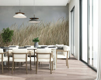 Woodland Dune Grass wallpaper showing beige wheat stalks swaying under grey sky.
