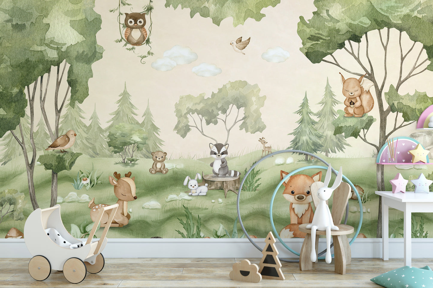 Woodland Joy Kids wallpaper mural with watercolor forest animals above a white toy pram in a green kids room