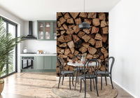 Woodpile Texture wallpaper mural of stacked logs in a sage green kitchen with round table and bistro chairs