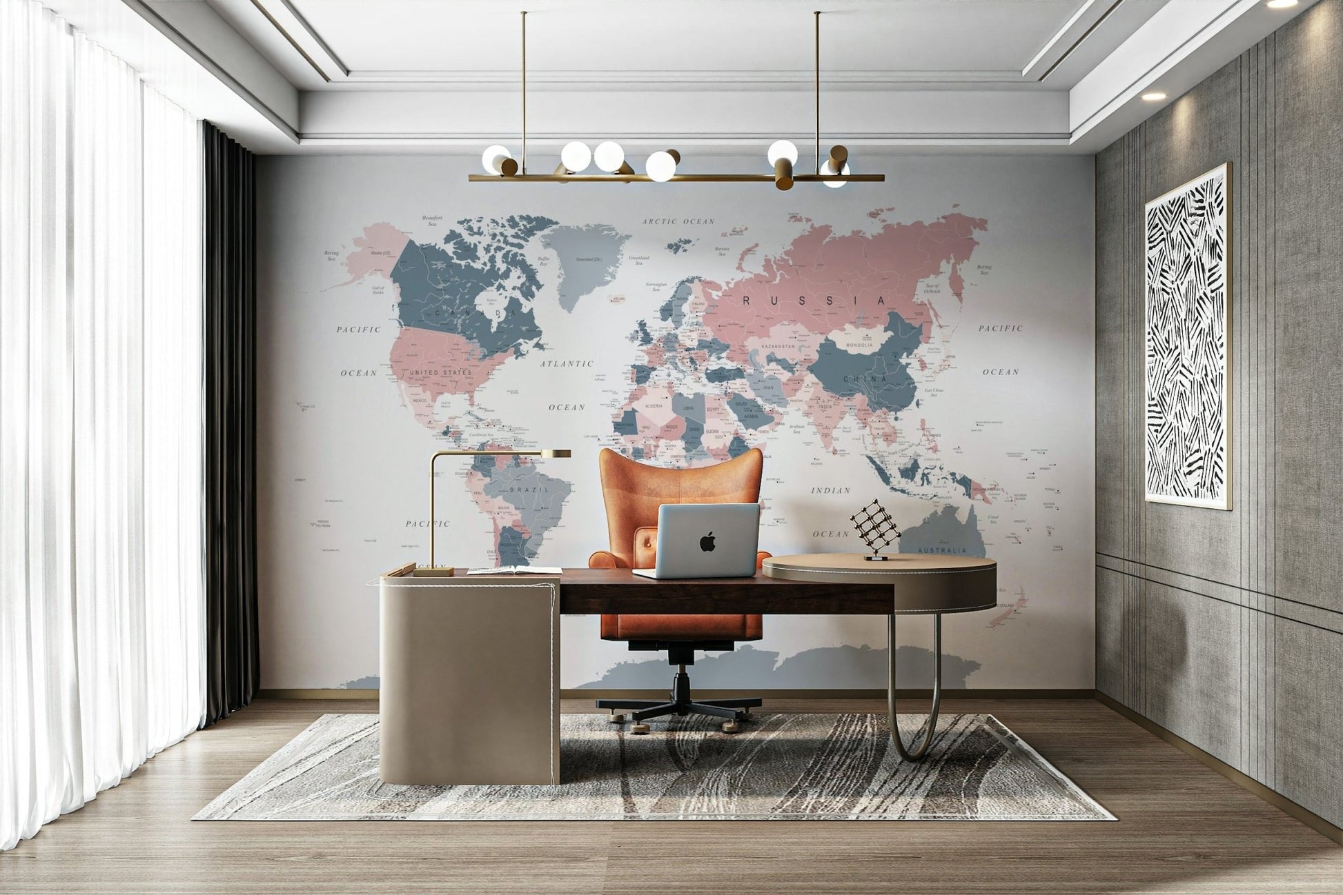 World Map Blush Pink and Indigo wallpaper mural behind a wood desk and orange leather chair in a home office