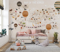 World Map Kids & Nursery wallpaper with balloons above a white daybed with pink bedding in a kids room