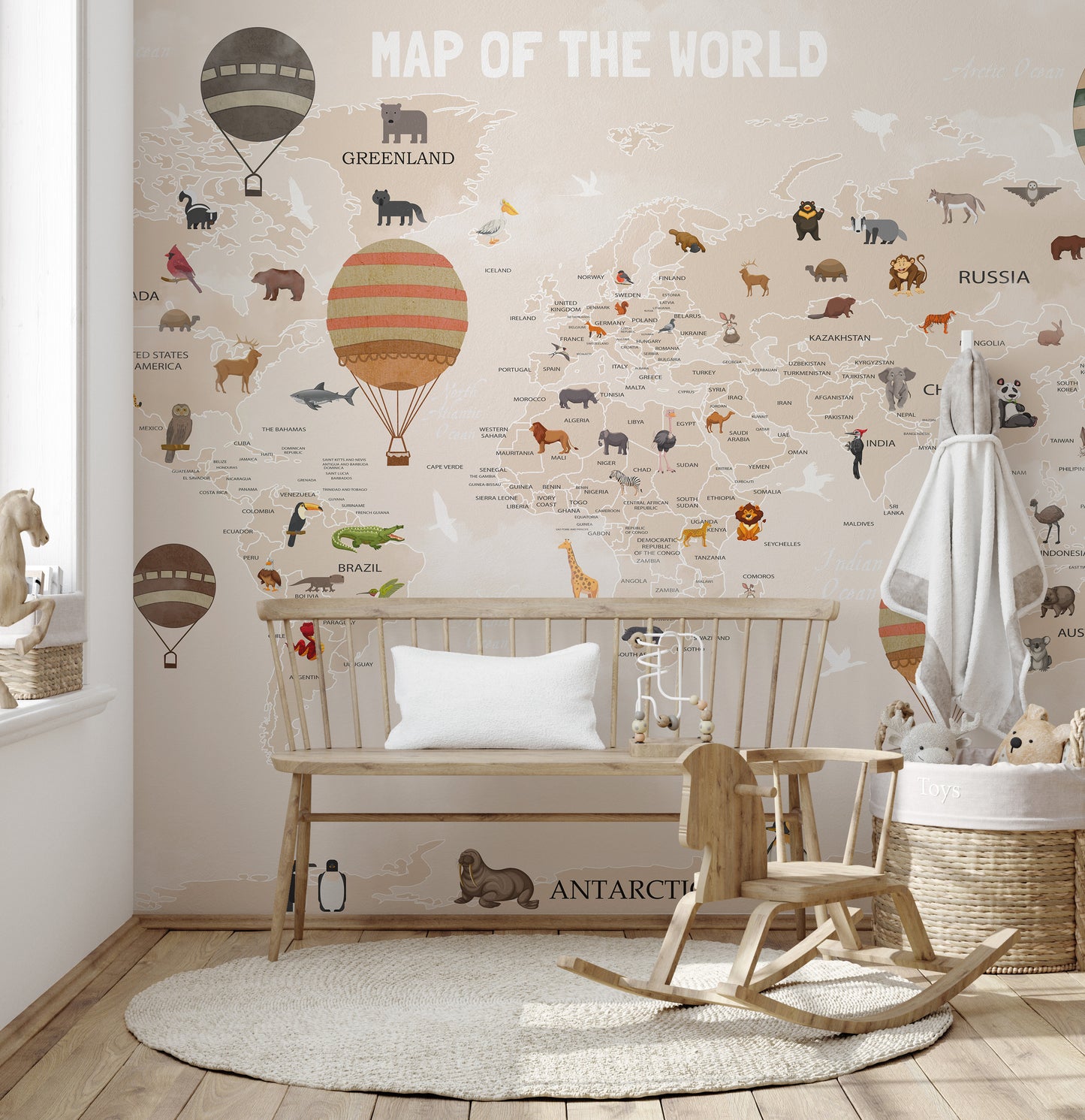 World Map Kids & Nursery wallpaper with cartoon animals behind a wooden bench and rocking horse in a nursery