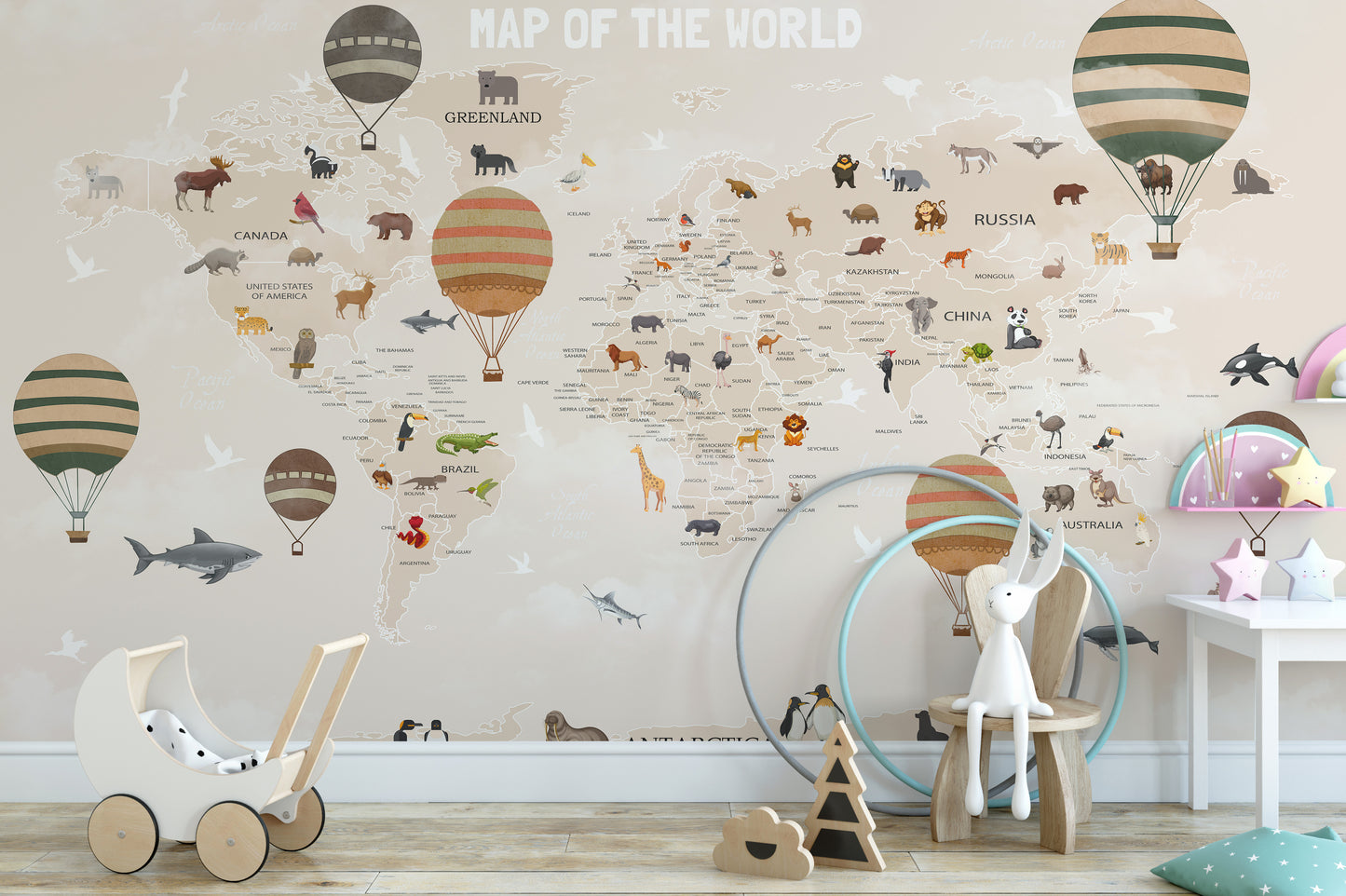 World Map Kids & Nursery wallpaper in beige with animals and hot air balloons above a wooden toy pram