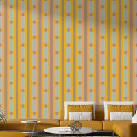 Playroom wall covered in yellow geometric wallpaper

