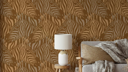 A wall mural of a zebra herd with artistic stripes.

