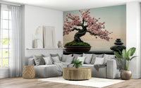 Zen Blossom Balance wallpaper mural of a pink blossom bonsai and stones above a large gray sectional sofa